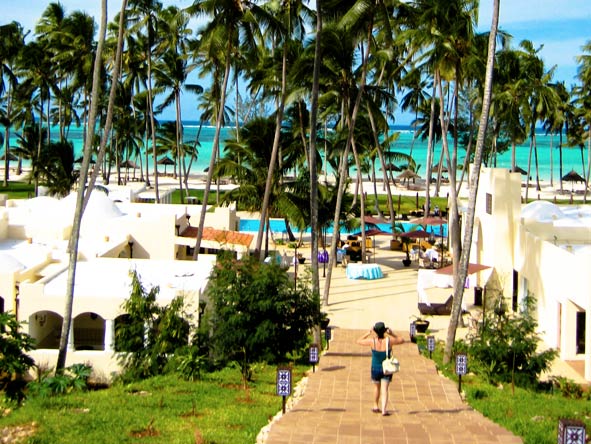 Emma Harrop - wandering through Dreams of Zanzibar Resort down to the beach